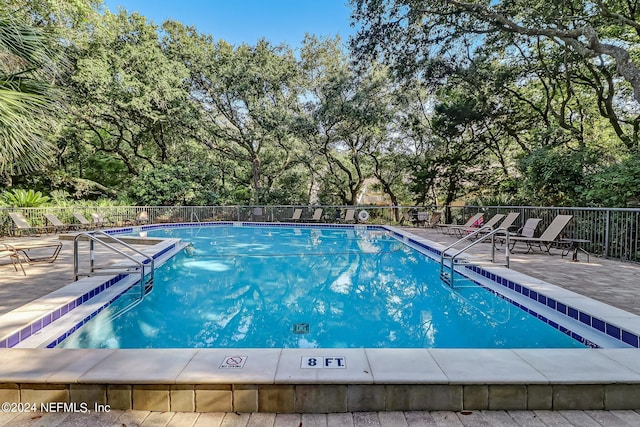 view of swimming pool featuring a patio