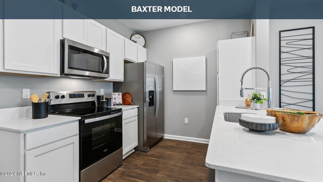 kitchen featuring dark hardwood / wood-style flooring, sink, white cabinets, and appliances with stainless steel finishes