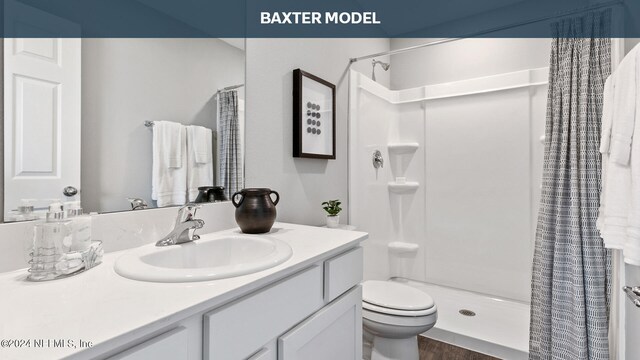 bathroom with walk in shower, vanity, toilet, and hardwood / wood-style flooring