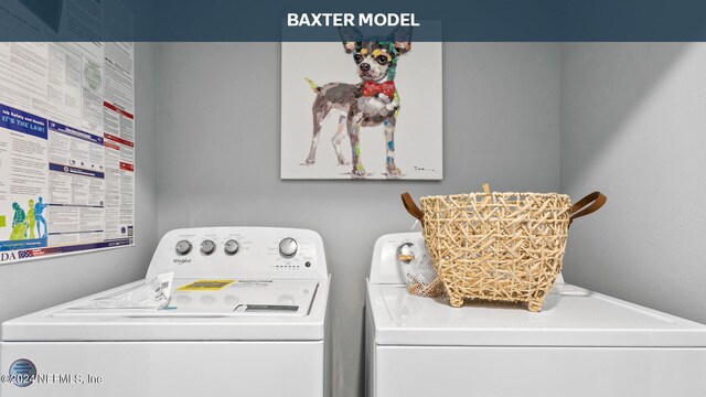 laundry area featuring washing machine and clothes dryer