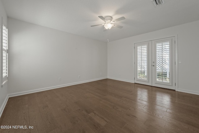 305 Garden Ln, Atlantic Beach, FL 32233 - unfurnished room with dark wood-style floors, visible vents, baseboards, and a ceiling fan