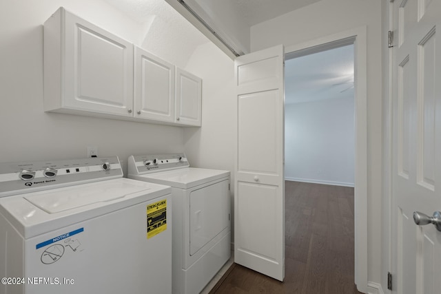 laundry area featuring dark hardwood / wood-style flooring, cabinets, and independent washer and dryer