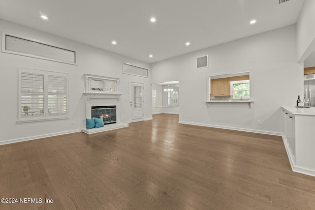 unfurnished living room featuring hardwood / wood-style flooring