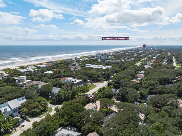 bird's eye view featuring a water view and a view of the beach