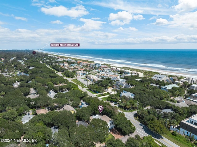 birds eye view of property featuring a water view and a view of the beach