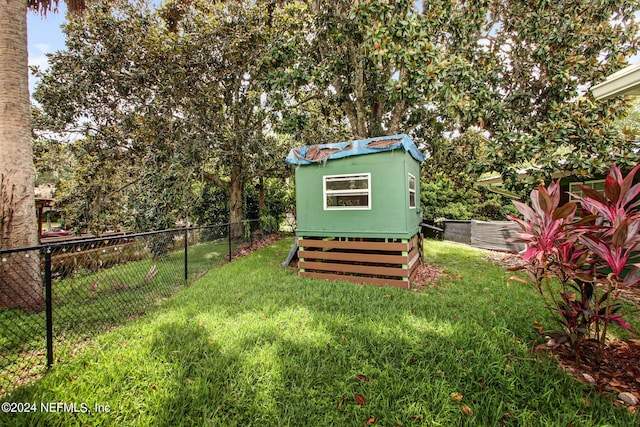 view of yard with a fenced backyard and an outdoor structure