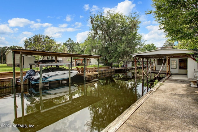 view of dock with a water view and boat lift