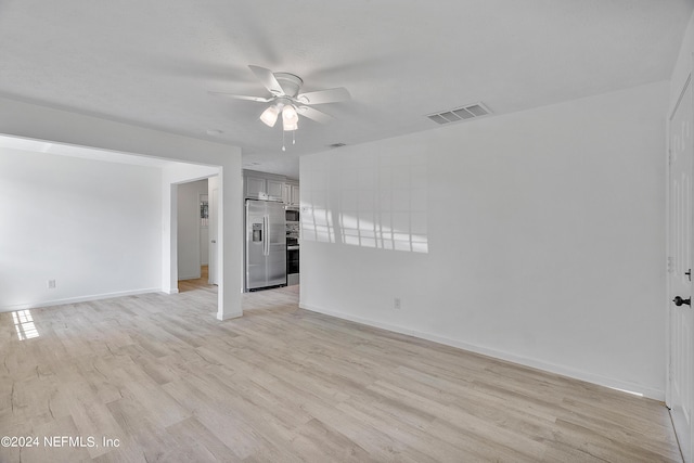 4435 Bedivere Rd, Jacksonville, FL 32208 - unfurnished living room featuring baseboards, light wood-style flooring, visible vents, and a ceiling fan