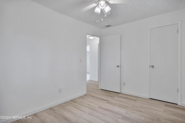 4435 Bedivere Rd, Jacksonville, FL 32208 - unfurnished bedroom featuring baseboards, visible vents, wood finished floors, and a ceiling fan