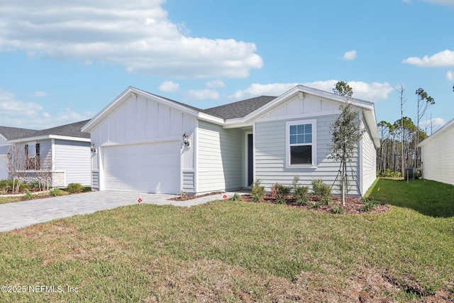 single story home featuring a garage, driveway, a front lawn, and board and batten siding