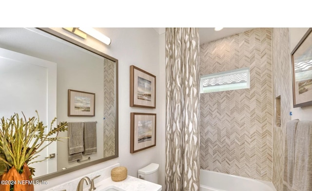 full bathroom featuring toilet, vanity, and shower / bathtub combination with curtain