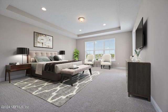 carpeted bedroom featuring a raised ceiling and a textured ceiling