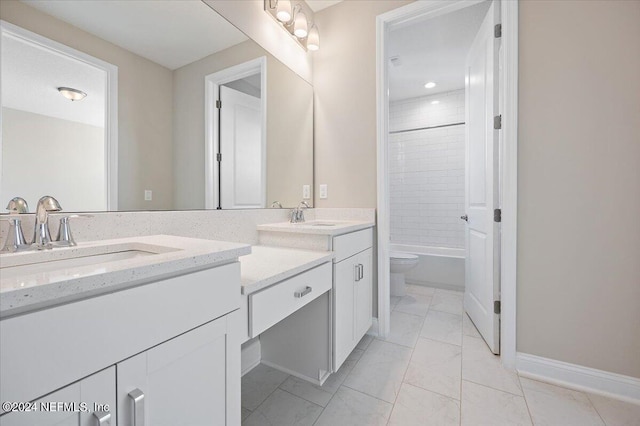 full bathroom with tiled shower / bath combo, vanity, and toilet