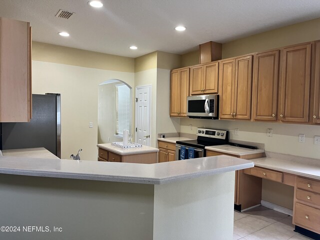 kitchen featuring light tile patterned floors, visible vents, stainless steel appliances, light countertops, and recessed lighting