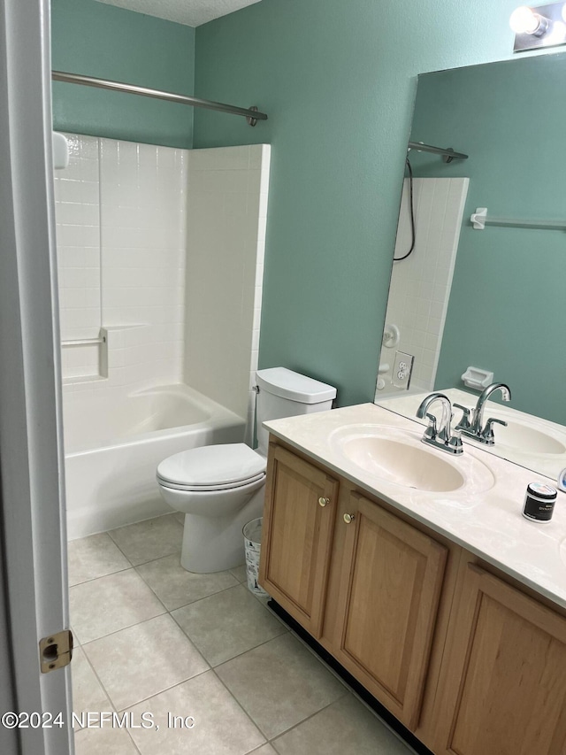 full bath featuring bathing tub / shower combination, vanity, toilet, and tile patterned floors
