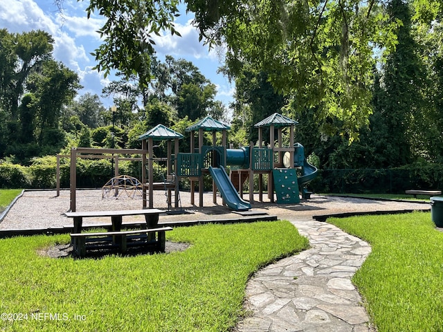 community play area with a lawn
