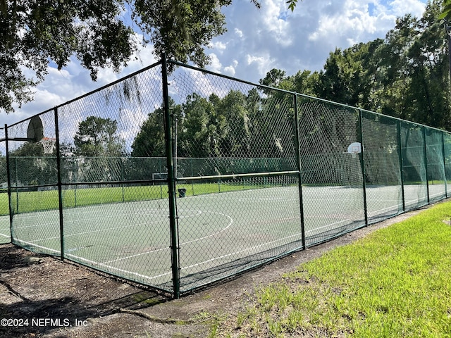 view of sport court featuring community basketball court and fence