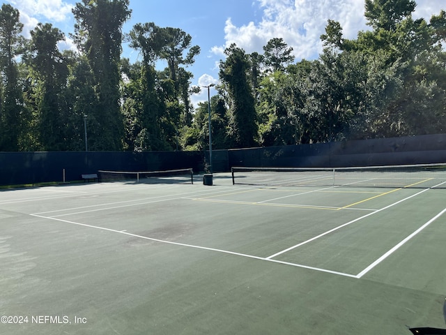 view of sport court with fence