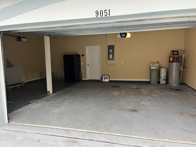 garage featuring a garage door opener, freestanding refrigerator, electric panel, and water heater