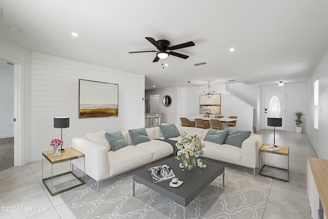 tiled living room featuring ceiling fan