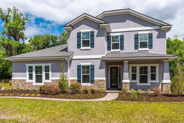 view of front of home featuring a front lawn