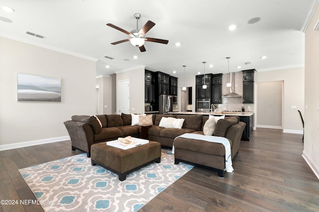 living room with ornamental molding and dark hardwood / wood-style floors