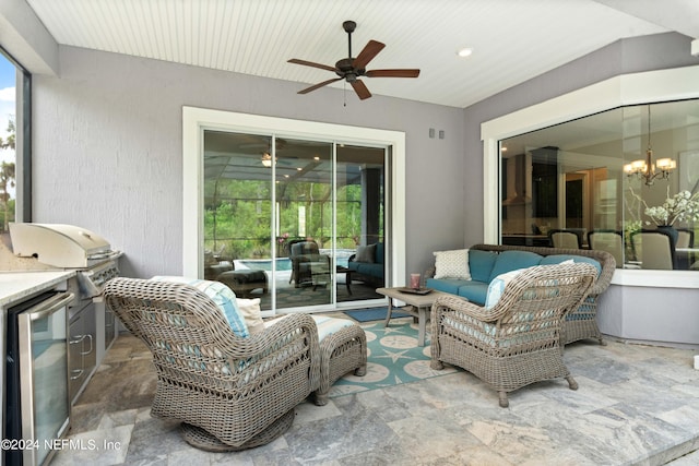 view of patio / terrace with ceiling fan, an outdoor hangout area, exterior kitchen, and area for grilling