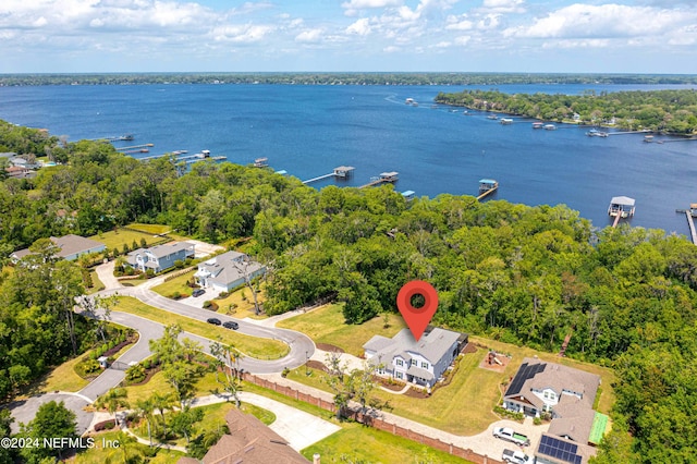 birds eye view of property featuring a water view