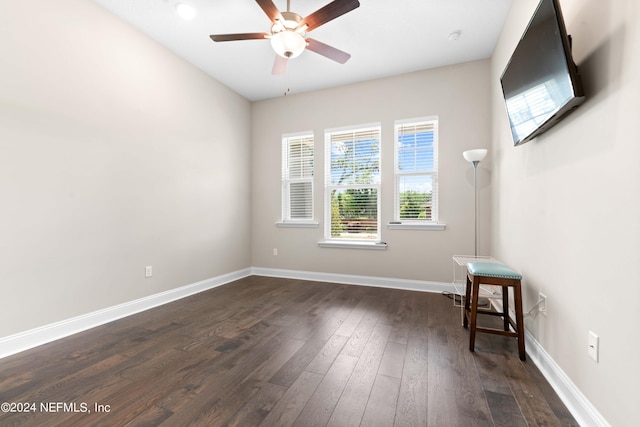 unfurnished room featuring ceiling fan and dark hardwood / wood-style floors