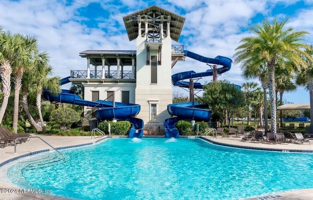 view of pool with a water slide