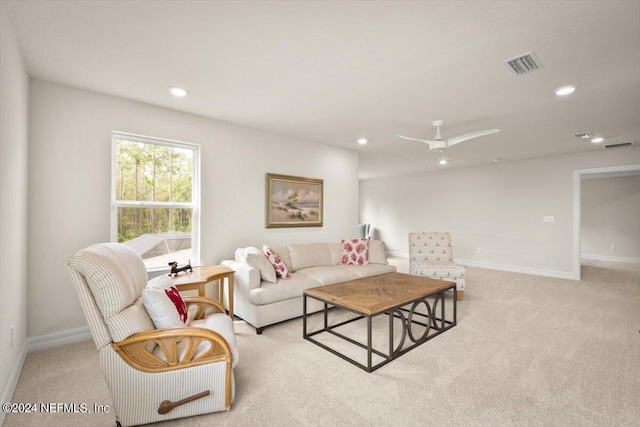 living room with light carpet and ceiling fan