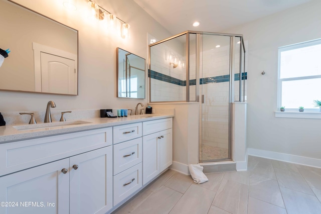 6833 A Ave, Saint Augustine, FL 32080 - bathroom featuring double vanity, baseboards, a stall shower, and recessed lighting