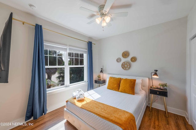 6833 A Ave, Saint Augustine, FL 32080 - bedroom with wood finished floors, baseboards, and ceiling fan