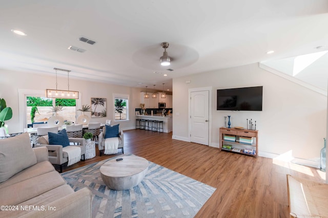 6833 A Ave, Saint Augustine, FL 32080 - living area with wood finished floors, ceiling fan, recessed lighting, and baseboards
