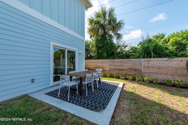 6833 A Ave, Saint Augustine, FL 32080 - fenced backyard featuring a patio area and outdoor dining area