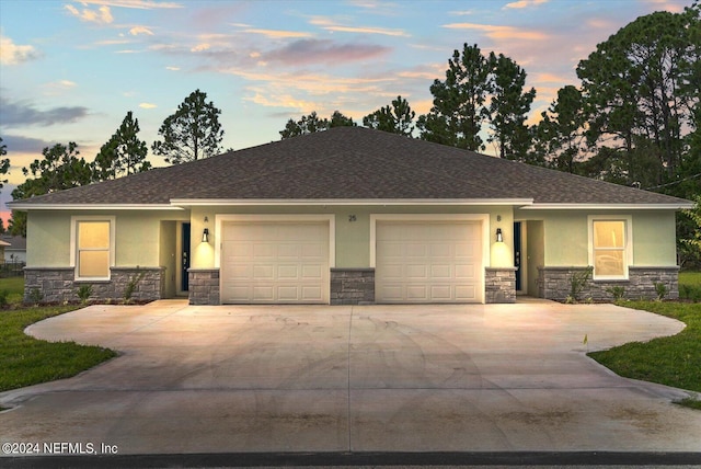 view of front of property with a garage