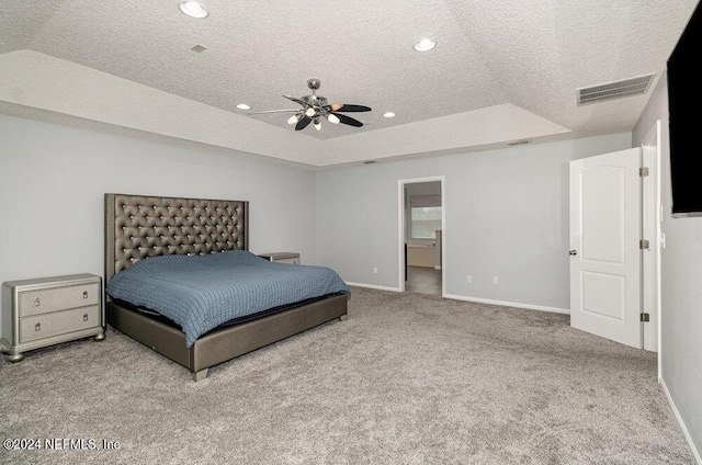 carpeted bedroom featuring baseboards, visible vents, a raised ceiling, a textured ceiling, and recessed lighting