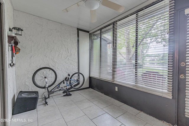 interior space featuring ceiling fan