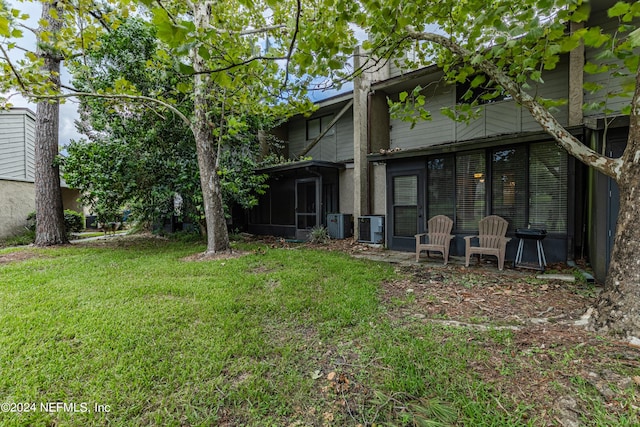 view of yard with a sunroom