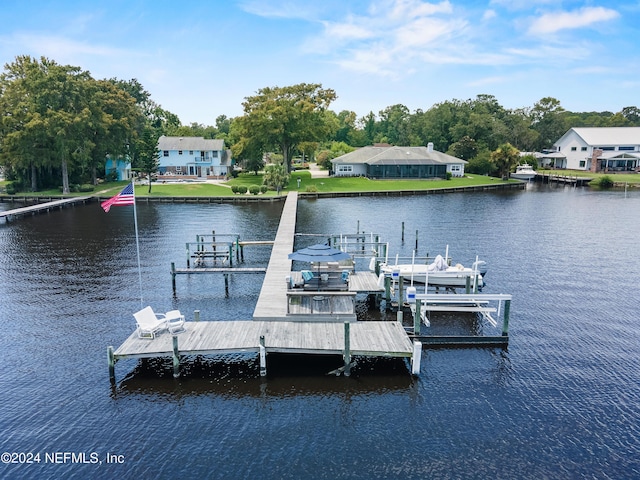 dock area with a water view and boat lift