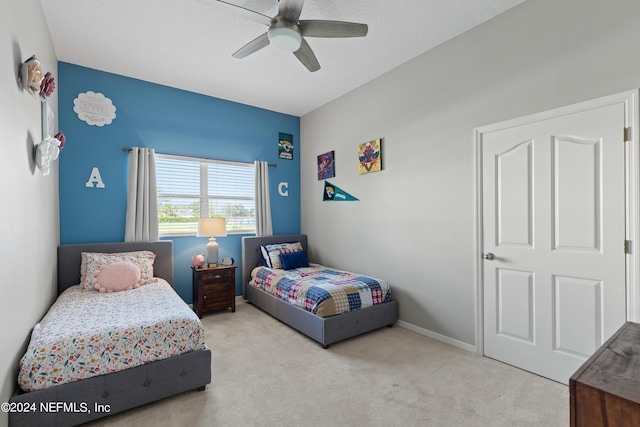 bedroom featuring carpet floors, baseboards, and a ceiling fan