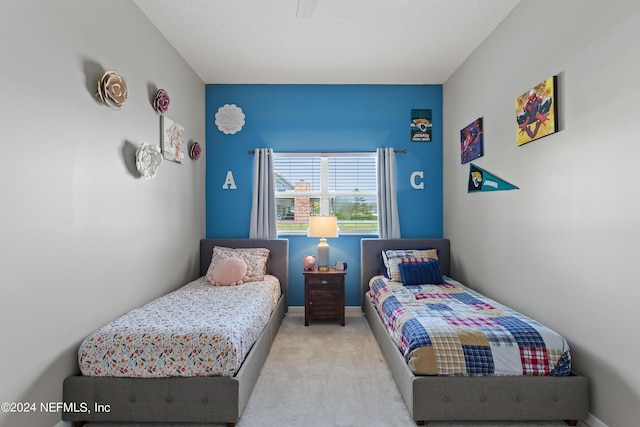 carpeted bedroom with baseboards