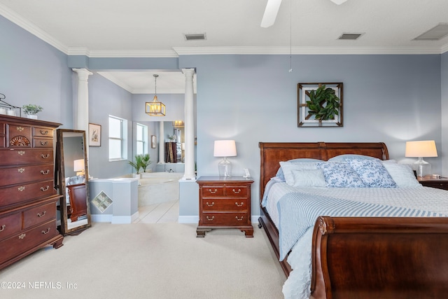 carpeted bedroom with ornate columns, visible vents, and crown molding