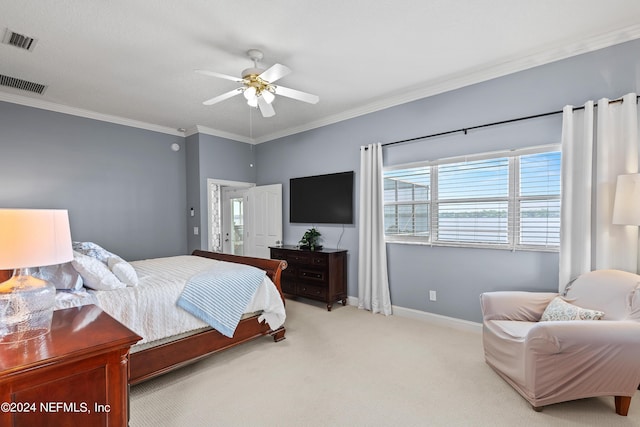 bedroom with visible vents, crown molding, light carpet, and baseboards