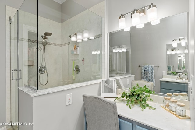 bathroom featuring a stall shower and vanity