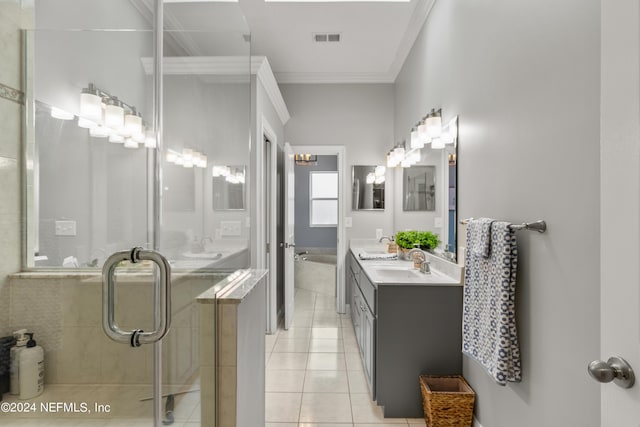 full bath featuring double vanity, visible vents, tile patterned floors, crown molding, and a sink