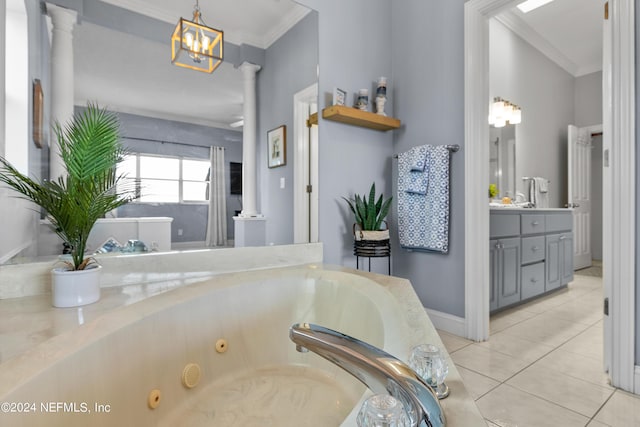 full bathroom featuring crown molding, decorative columns, a tub with jets, and tile patterned floors