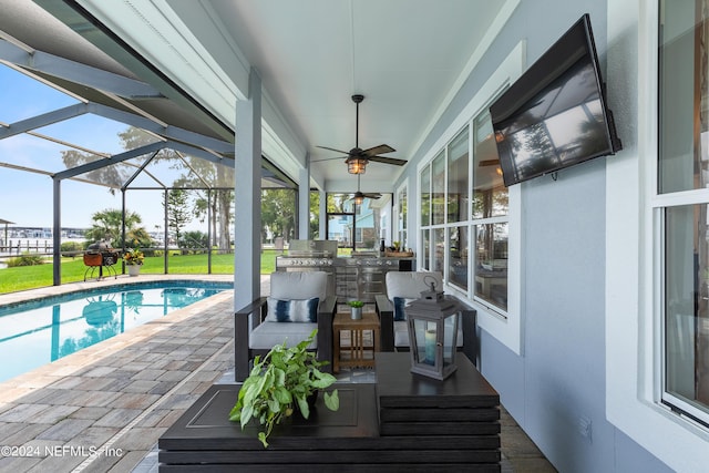 exterior space featuring a ceiling fan, a lanai, a grill, and an outdoor pool