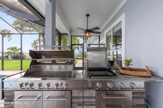 exterior space with ceiling fan, glass enclosure, and area for grilling