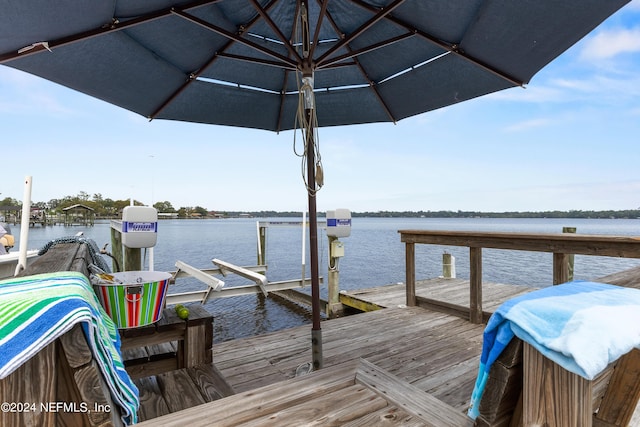 view of dock featuring a water view and boat lift